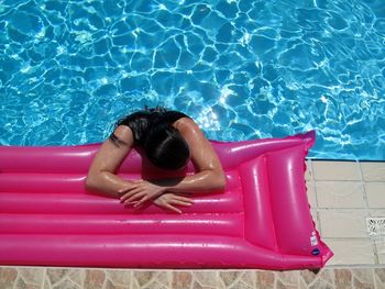 High angle view of woman swimming in pool