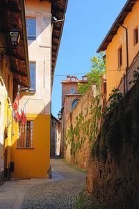 Narrow street amidst buildings in town