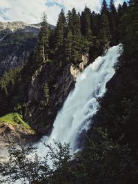 Scenic view of waterfall in forest