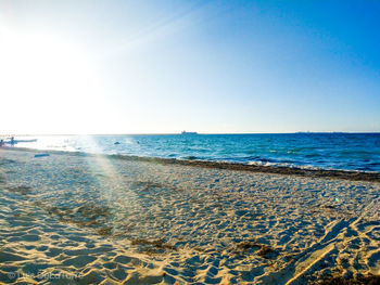 Scenic view of beach against clear sky