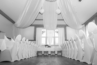 Empty chairs in corridor