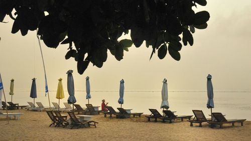 View of closed canopies against calm sea