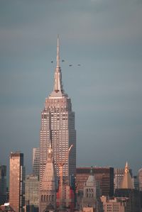 Buildings in city against sky