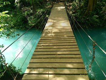 High angle view of footbridge over water