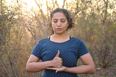Beautiful female teacher doing yoga asanas and meditation poses 