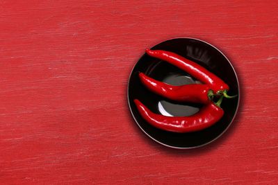 High angle view of red chili pepper on table