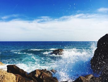 Close-up of sea against blue sky