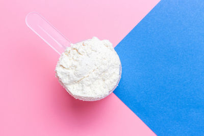 High angle view of bread on pink table