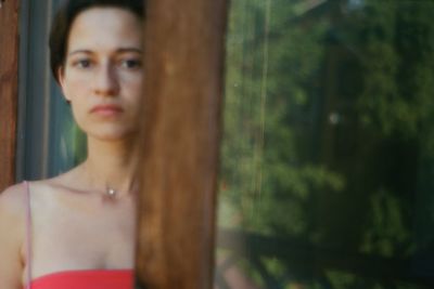 Portrait of young woman standing outdoors