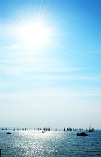 Scenic view of sea against sky on sunny day