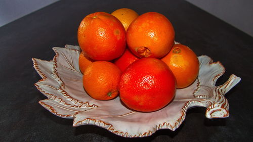 High angle view of tomatoes in plate on table