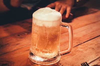 Close-up of beer glass on table