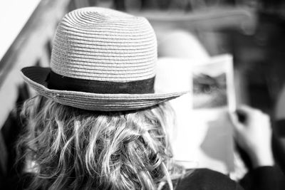 Rear view of woman wearing hat