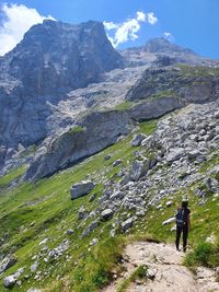 Rear view of man walking on mountain