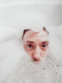 Portrait of mature man in bathtub