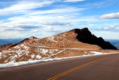 Scenic view of mountain road against sky