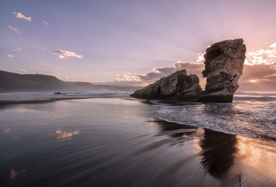 Scenic view of sea against sky at sunset