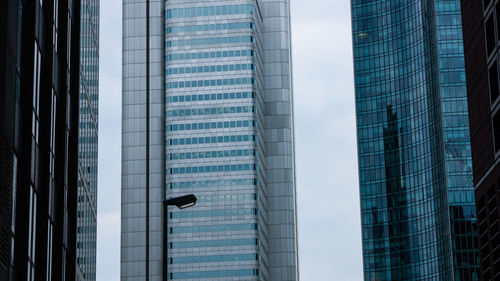 Low angle view of modern buildings against sky