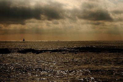 Scenic view of sea against sky at sunset