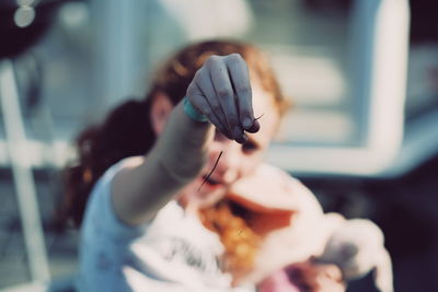 Close-up of woman holding hands