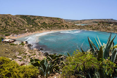 Scenic view of lake against clear blue sky