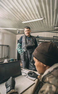 Portrait of young man working in office