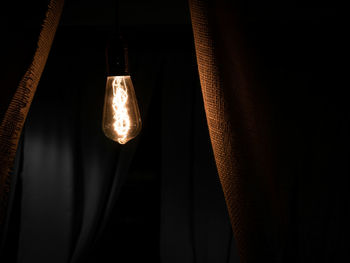 Close-up of illuminated light bulb