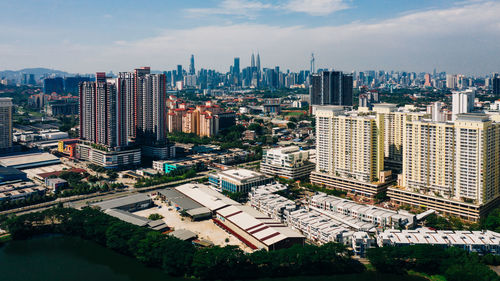 High angle view of buildings in city against sky