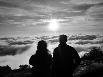 Rear view of silhouette couple against sky