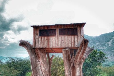 Built structure on landscape against sky