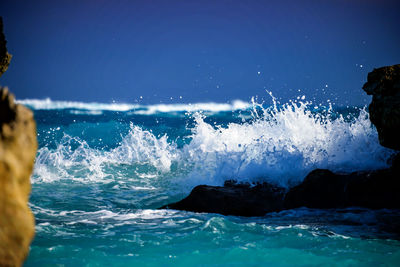 Waves splashing on rocks