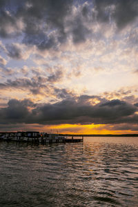Scenic view of sea against sky at sunset