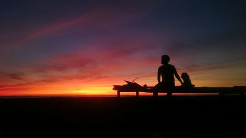 Silhouette of people at sunset