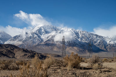 Scenic view of snowcapped mountains against sky