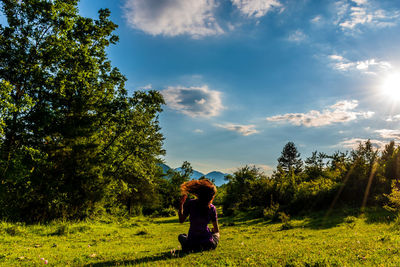 Man standing on field against sky
