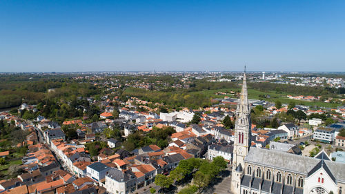 High angle view of townscape against clear blue sky