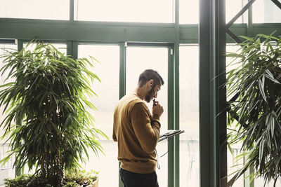 Man standing by window