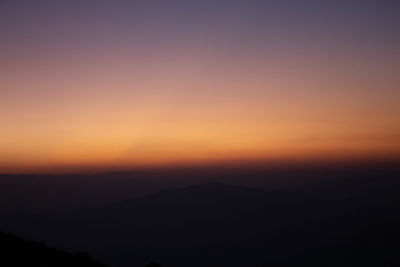 Scenic view of silhouette landscape against romantic sky at sunset