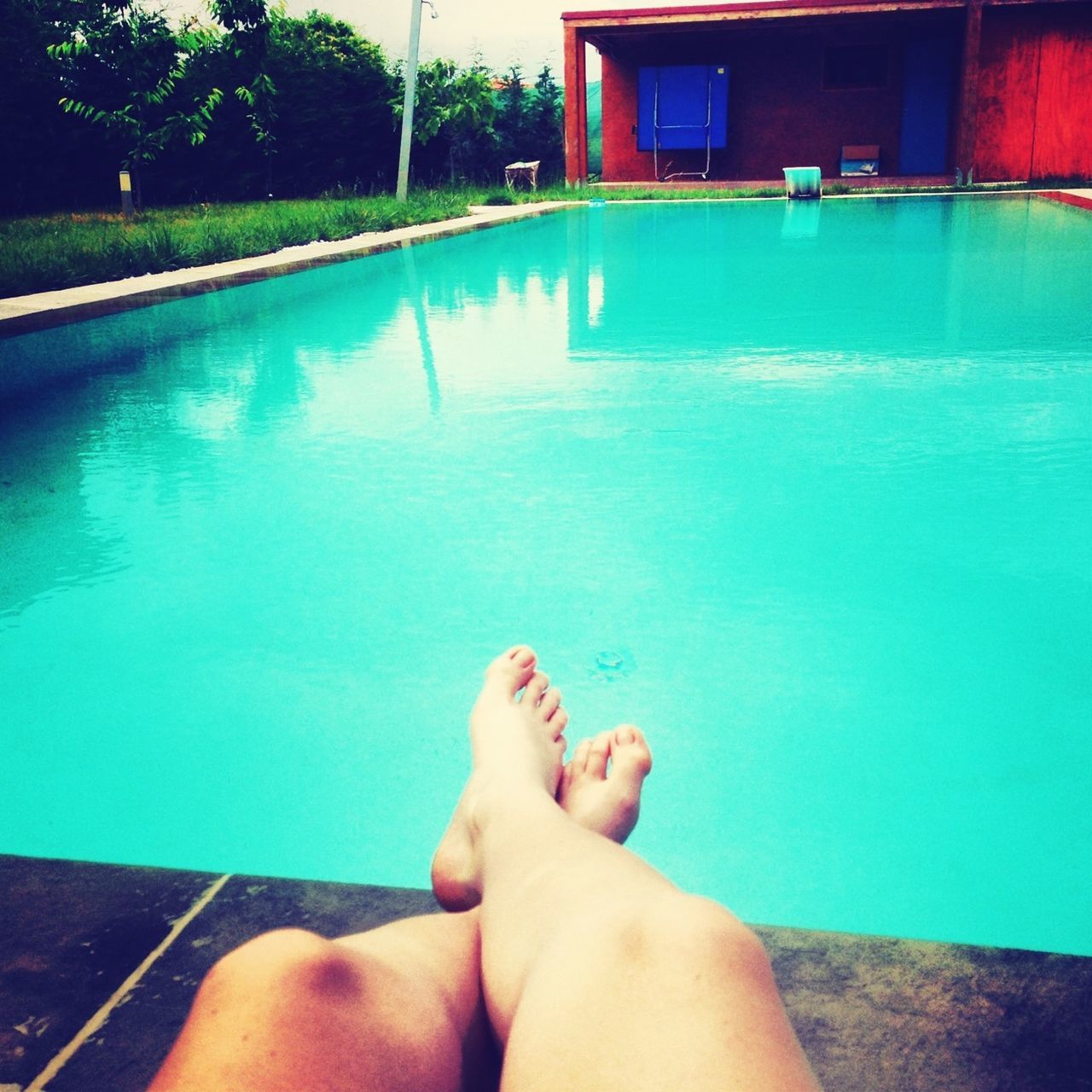 water, swimming pool, person, personal perspective, low section, blue, barefoot, leisure activity, part of, lifestyles, turquoise colored, human foot, poolside, high angle view, rippled, relaxation