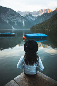 Rear view of woman looking at lake