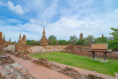 View of temple building against cloudy sky