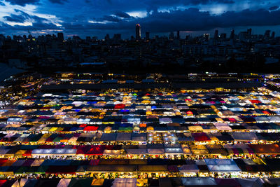 High angle view of illuminated buildings in city at night