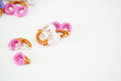 High angle view of pink roses against white background