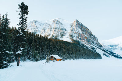 Tilt image of house against sky during winter