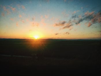 Scenic view of landscape at sunset