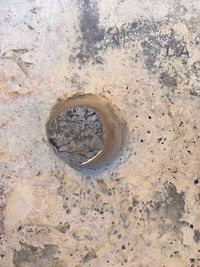 High angle view of hole on rock