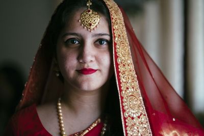 Close-up portrait of smiling young woman