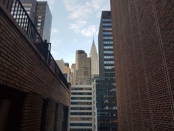 Low angle view of buildings in city against sky