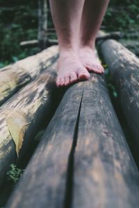 Close-up of hands on wood