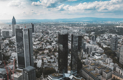 Aerial view of cityscape against sky